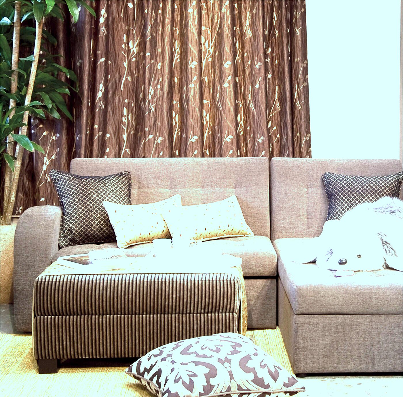 Corded sectional dressed in patterned scatters